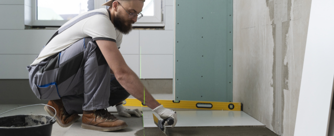 Tiler working renovation apartment